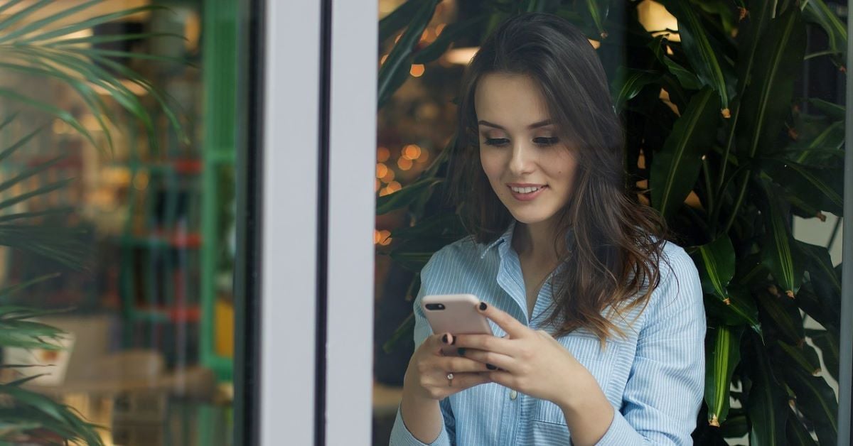 Lady looks at a campus app on the phone